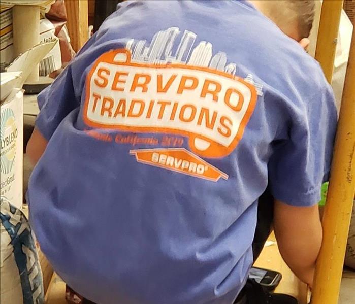 young boy in servpro traditions shirt